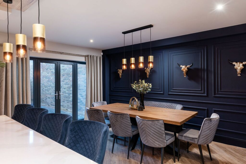 Dining area with modern lighting and French doors at Marina West